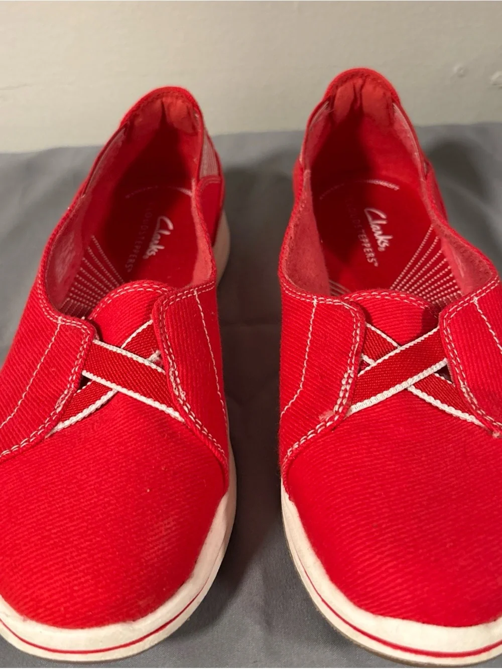 Clarks Women’s Red Slip-On Canvas Sneakers cloudsteppers